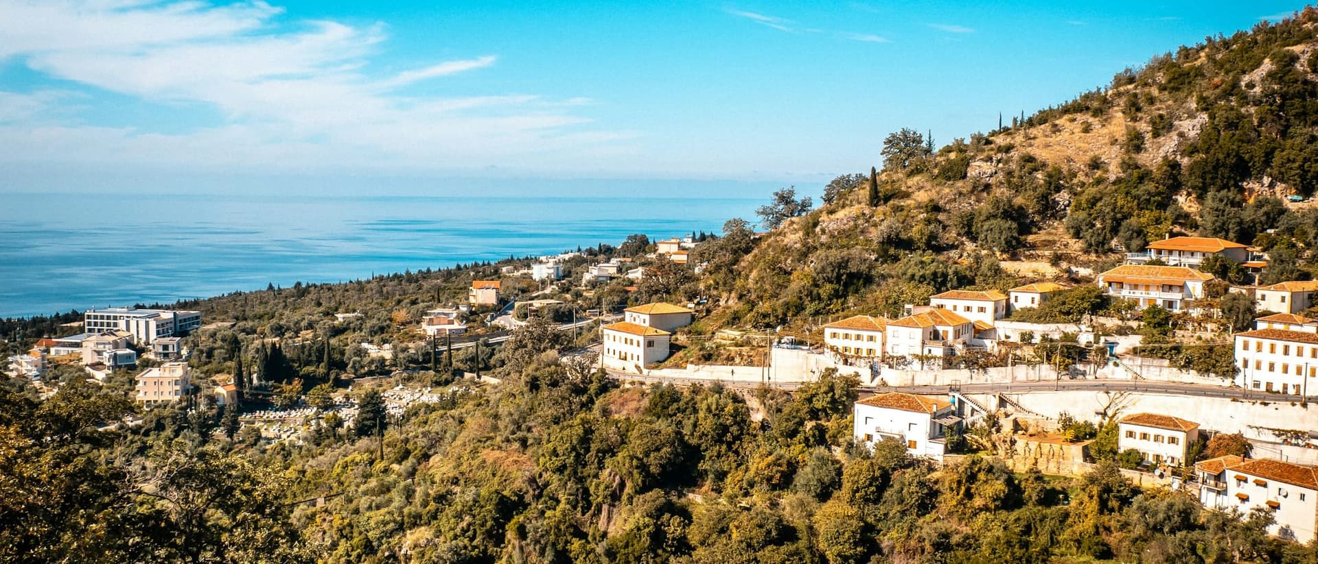 The coastal village of Dhërmi on the hillside above the Ionian Sea